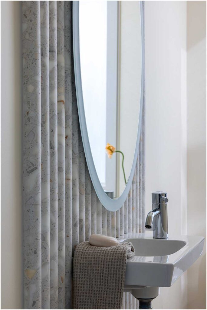 simple powder bath with terrazzo wall detail — interior design photography for designers