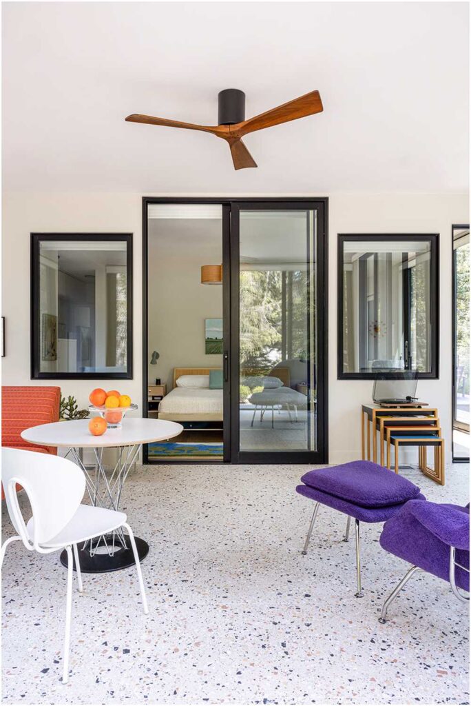 Midcentury modern kitchen four seasons room with bold furniture — interior design photography for designers