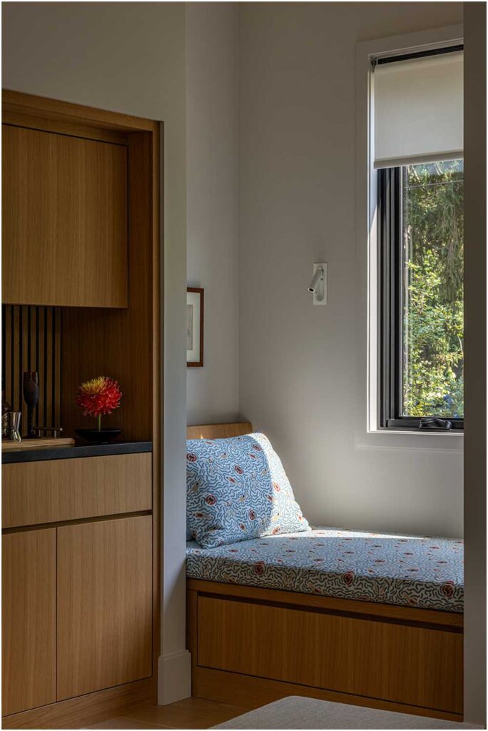 Midcentury modern reading nook with blue and red floral upholstery and built in reading light — interior design photography for designers